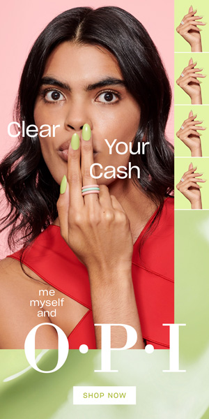 Model wearing Clear Your Cash, a creamy green shade.