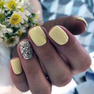 A pastel yellow nail polish