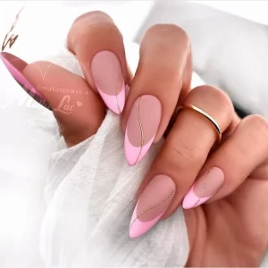 Light pink nail polish with some nail art accessories