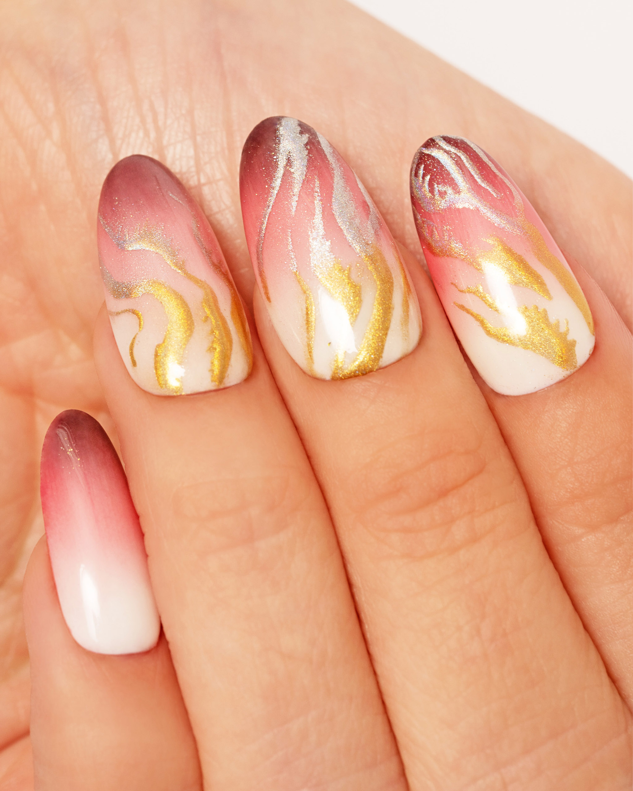 Hand Shot of Ombre Glam Nail Polish 