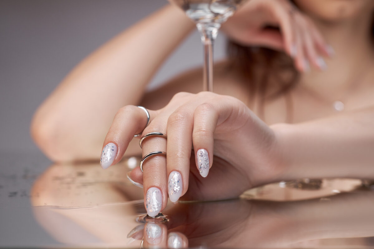 Beautiful manicure on the nails of a woman. Color coloring of the nails on the hand. Gentle, well-groomed hands. CND 2025 new Shellac gel polish collection