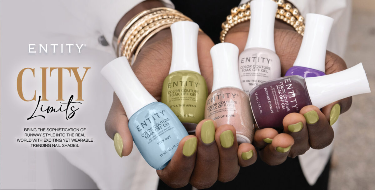 A faceless woman with painted nails in the kaki green crème shade from the City Limits collection from Entity, holding the bottle's collection shades