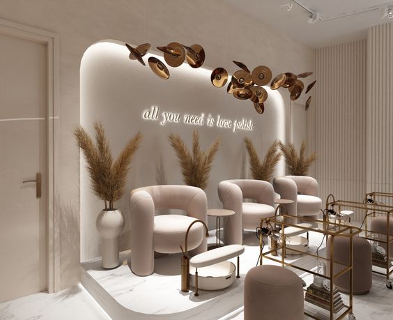 The beige furniture in a nail salon complements a boho chic nail salon theme.