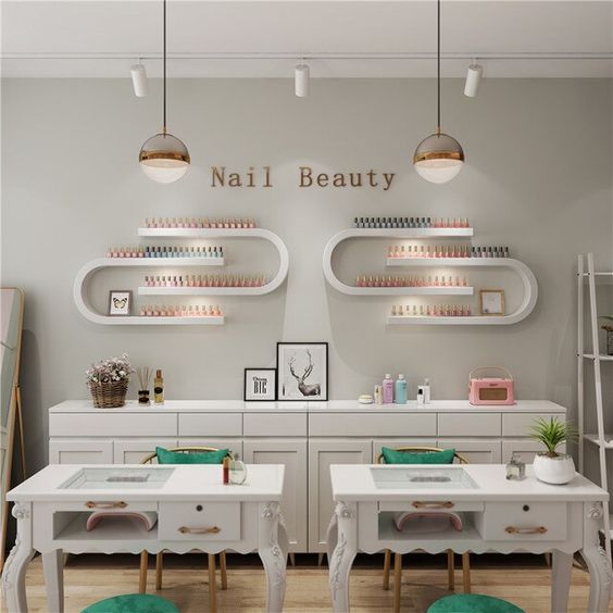 A nail beauty room with two tables and chairs with a classic elegance theme of a nail salon