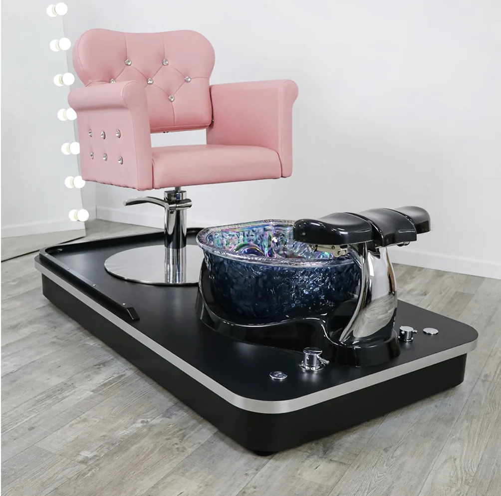 A pipeless pedicure bowl and a pink pedicure chair in a nail salon