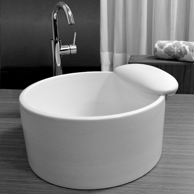 A white acrylic pedicure bowl in a nail salon