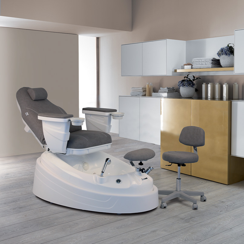 Gray and white pedicure chair in a spa center room