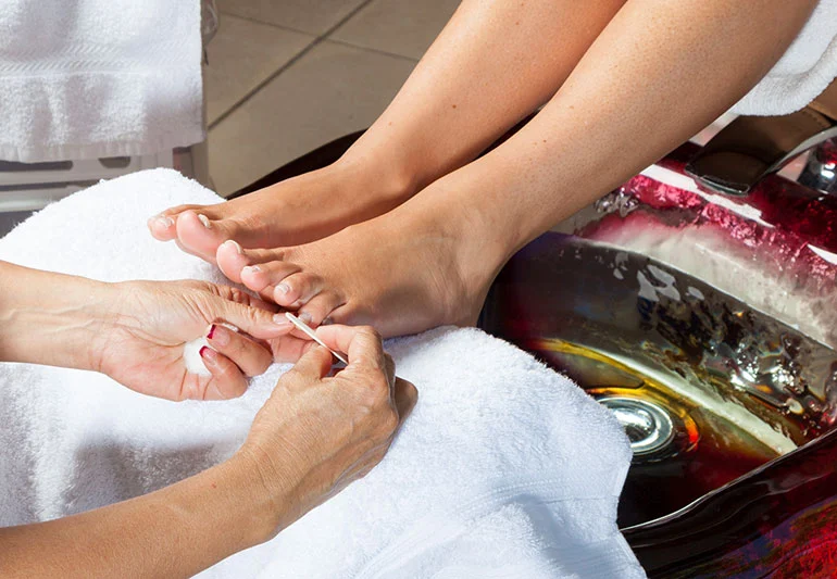 A woman getting a pedicure at a spa.