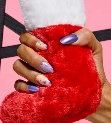 A woman nails painted with Frost Bite Me, Entice ‘em with a playful lavender look.