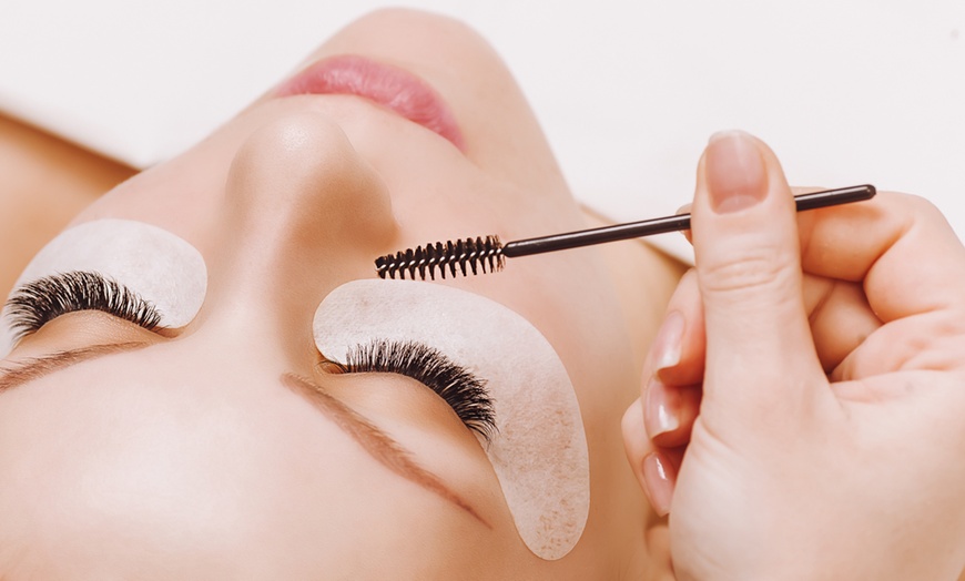 The final step of applying Adrell lashes. applying mascara