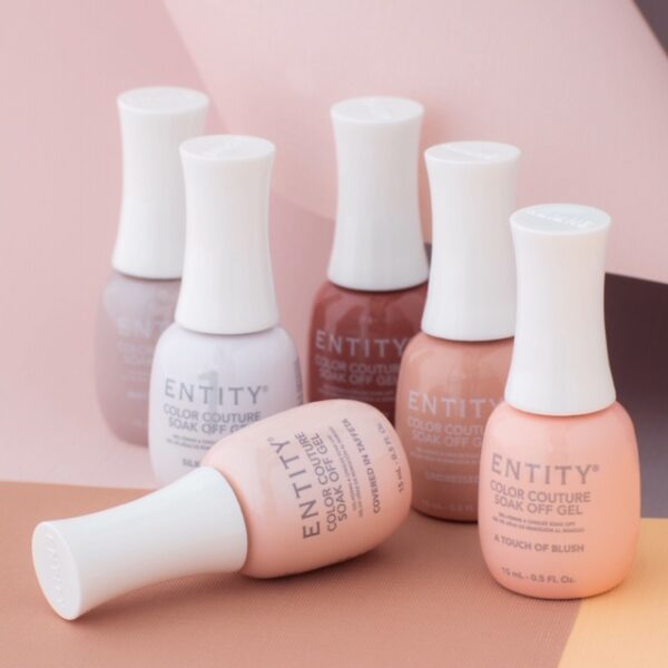 Entity Gel-Lacquer bottles collection in different shades are arranged on a pink background. Hybrid Gel Polish