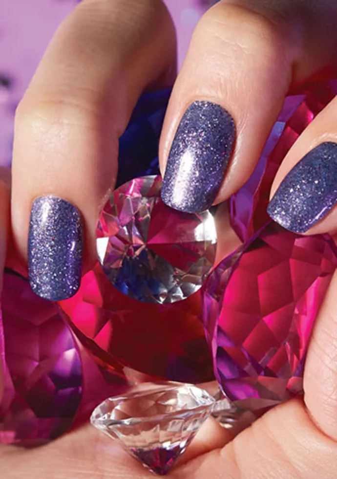 Female hand with glitter nails painted from the OPI High Definition Glitters