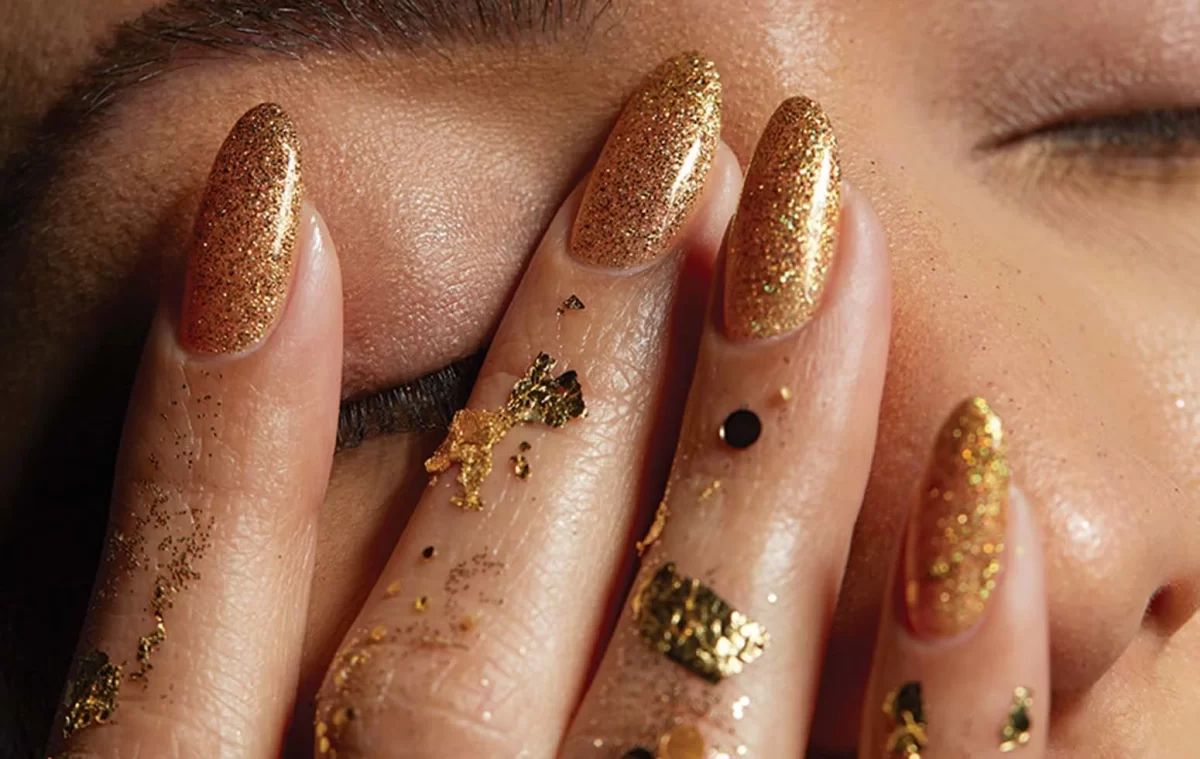 Glitter gold painted nails from OPI Glitter collection.