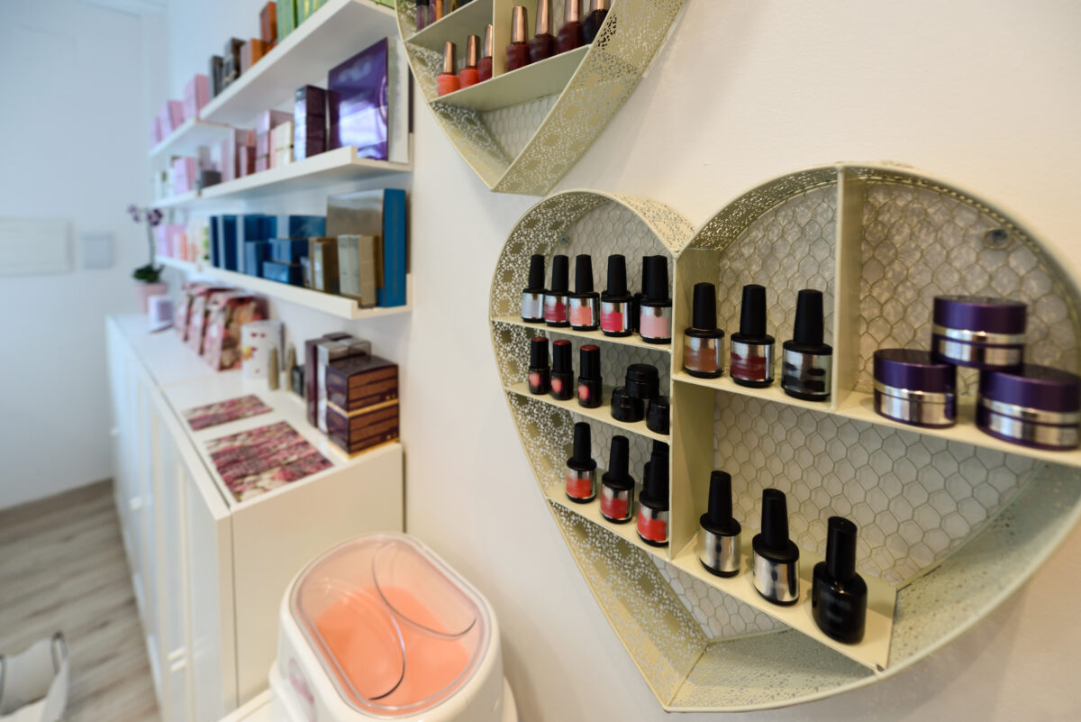 Cosmetic section with nail polish, facial cream, conditioners, shampoo, and hair treatment in-store