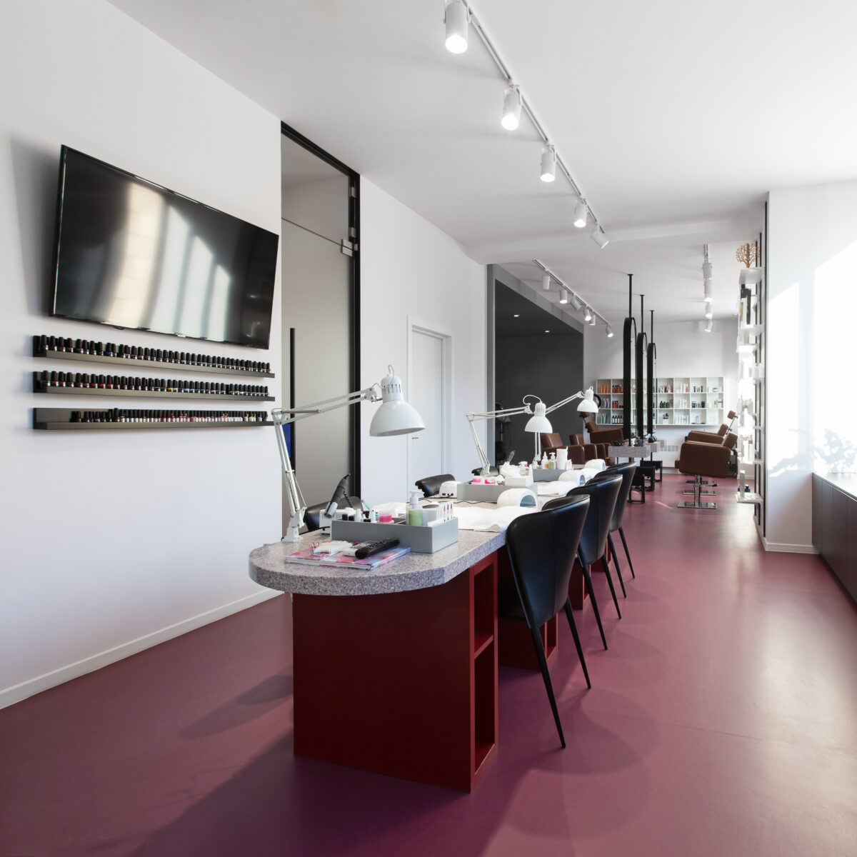 Beauty salon, no people. Interior of an empty modern nail salon. Workplaces for masters of manicure. Pedicure cabinet.
