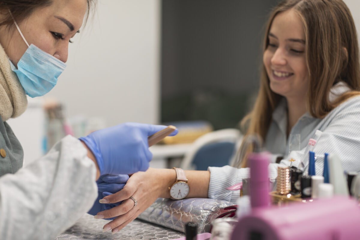 Young woman getting a beautiful manicure in a salon