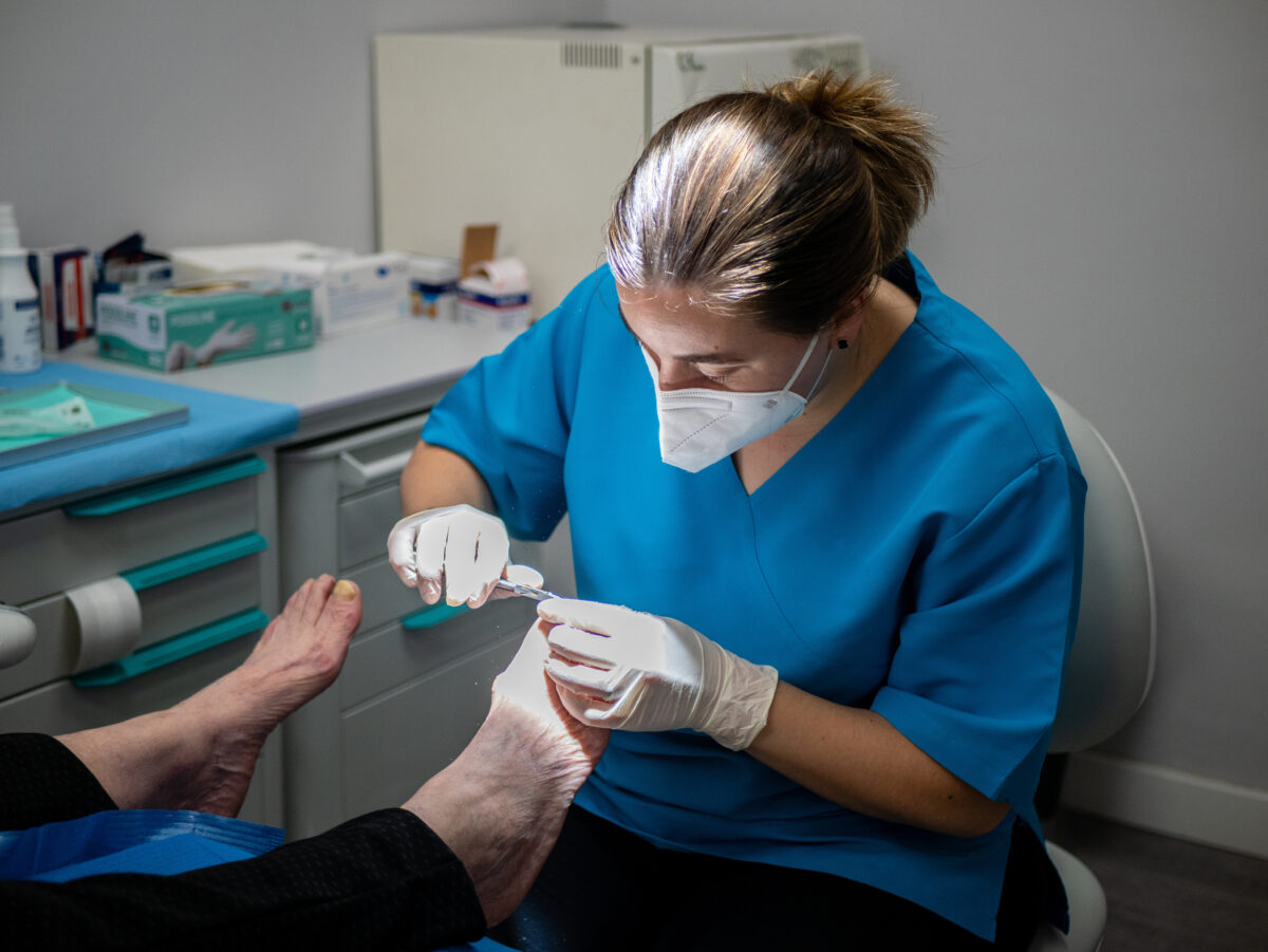 A podiatrist treats toenail fungus, removes calluses, and heals an ingrown toenail