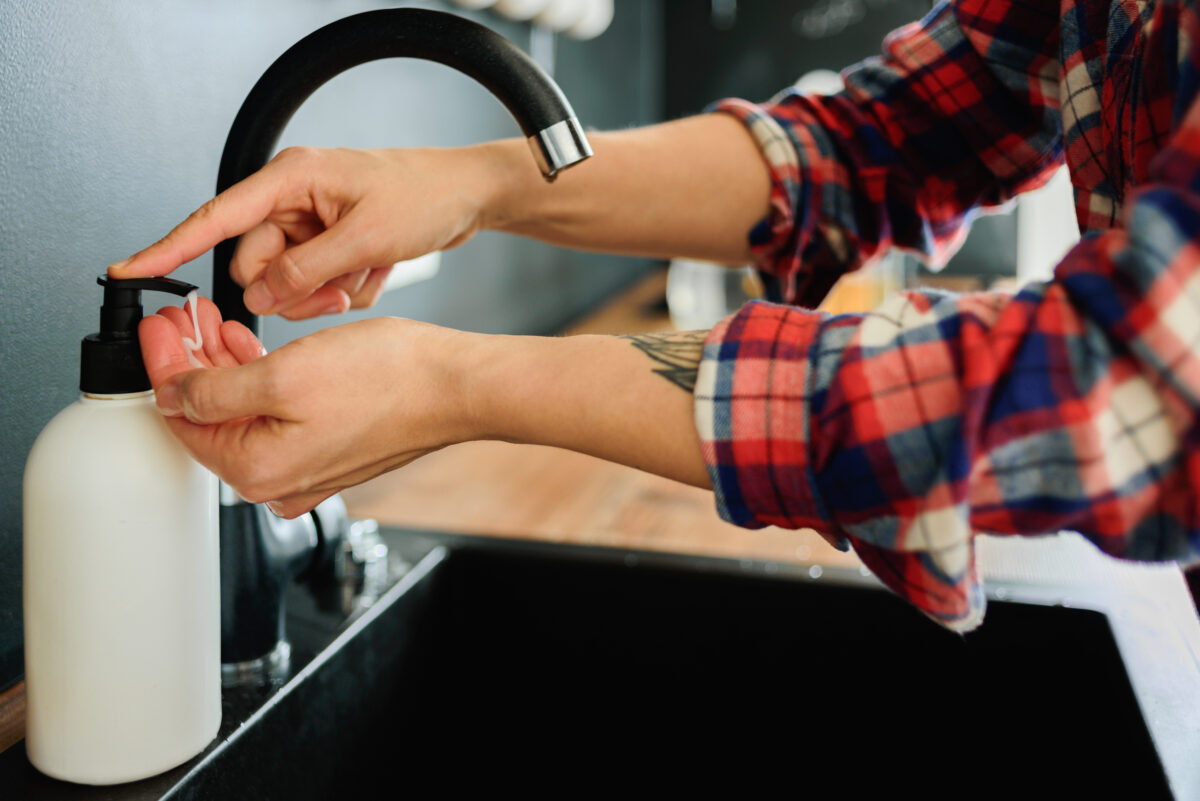 Woman washing hands with soap at salon. Personal hygiene. personal protective equipment