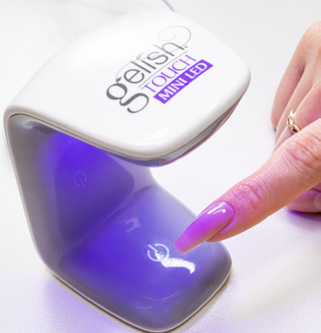 Sixth step of the applying technique for the Soft Gel Neutral Tips, cure the tips under Gelish LED Light