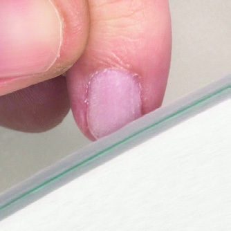 Fourth step of the removing steps of the Soft Gel Tips, buffing the nail surface with a buffer