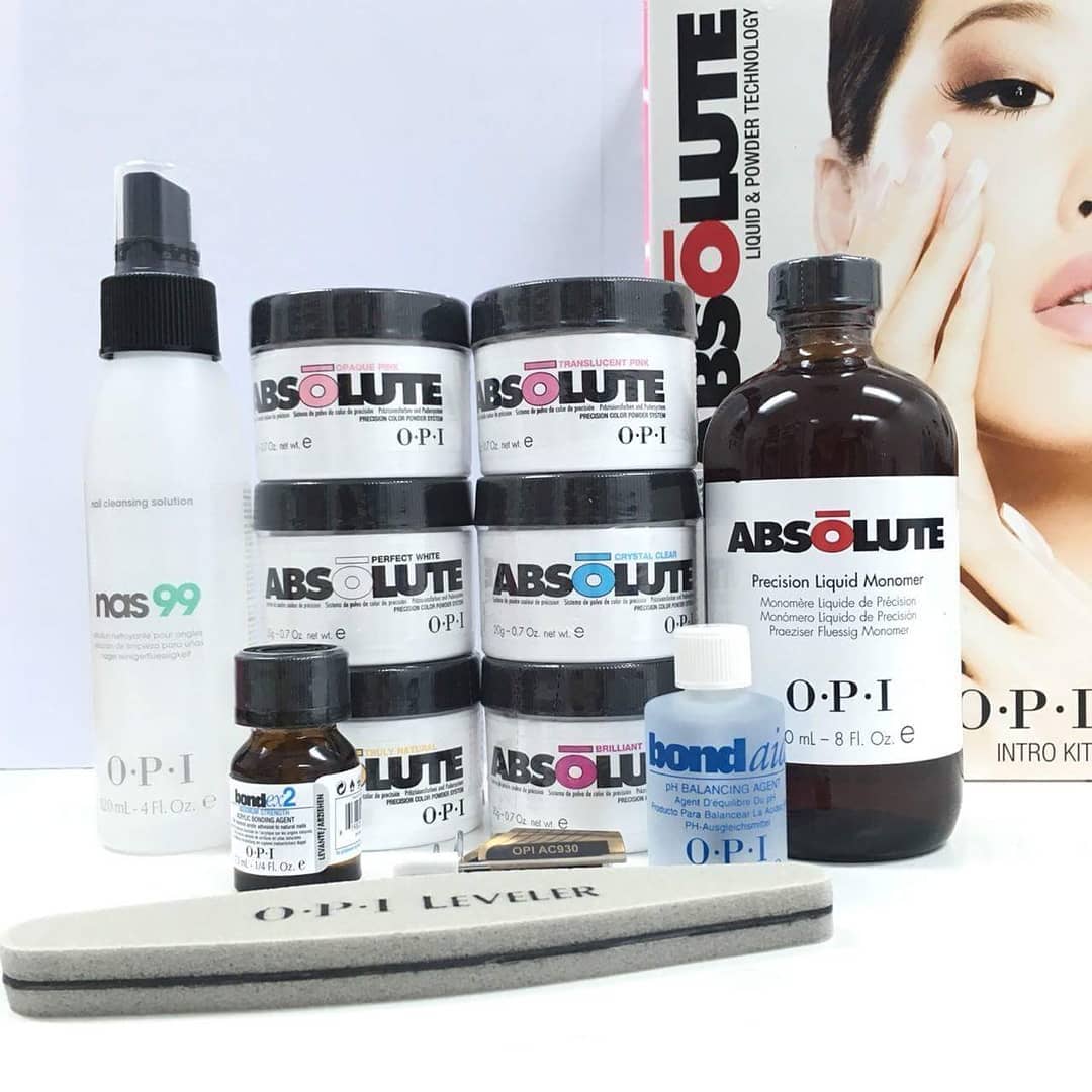 The OPI Absolute Powder line products, powder shades, pH Bond, nail files and a liquid monomer