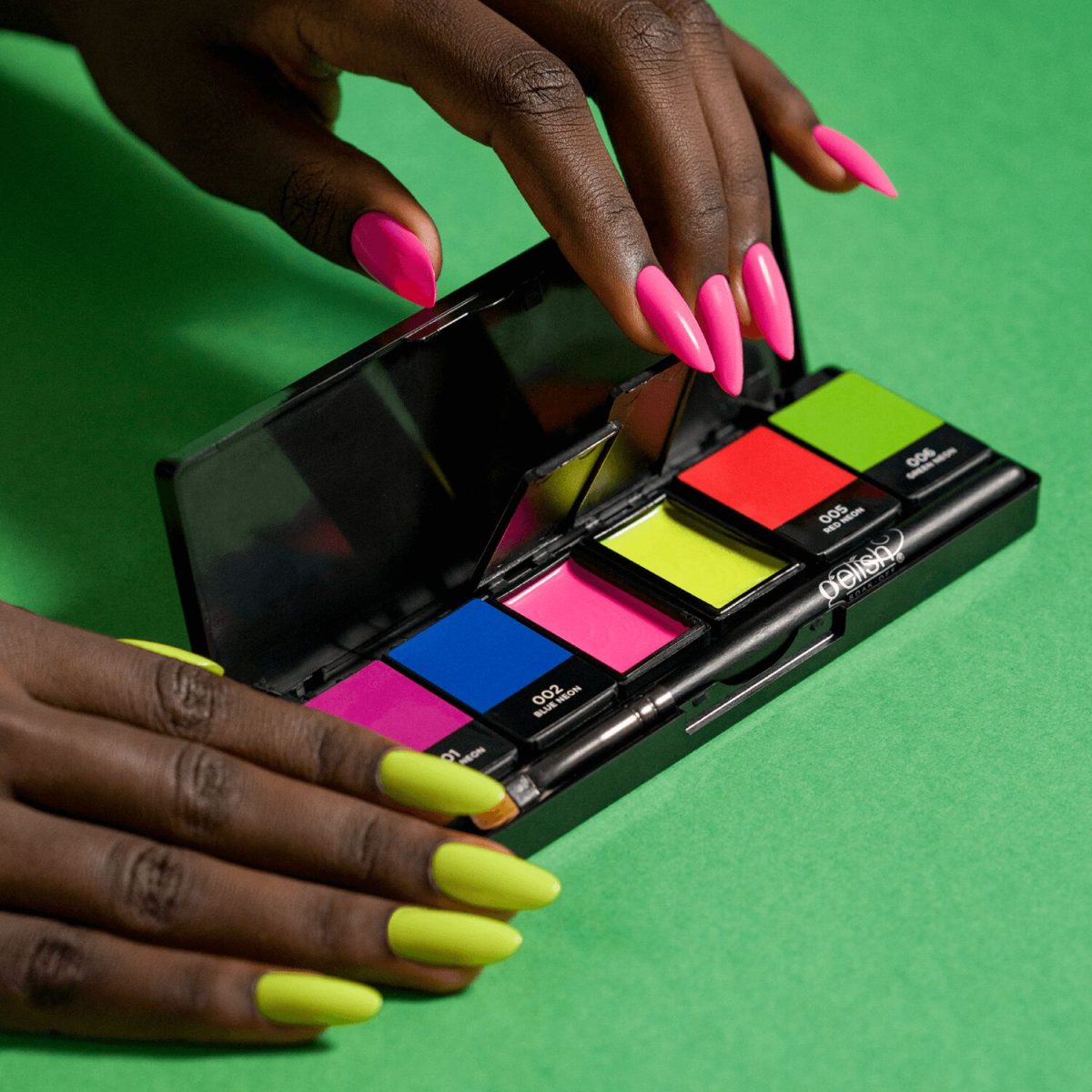 A faceless woman with hands with painted nails in neon yellow and pink using the Neon & On & On palette from Gelish Solid Cream Gels Palette.