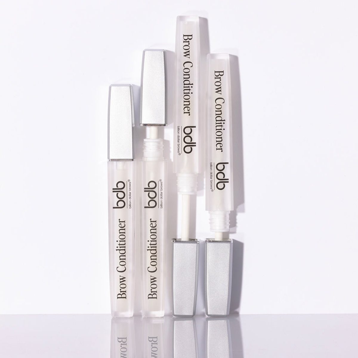 BDB Brow Conditioner bottles, display on a white wall