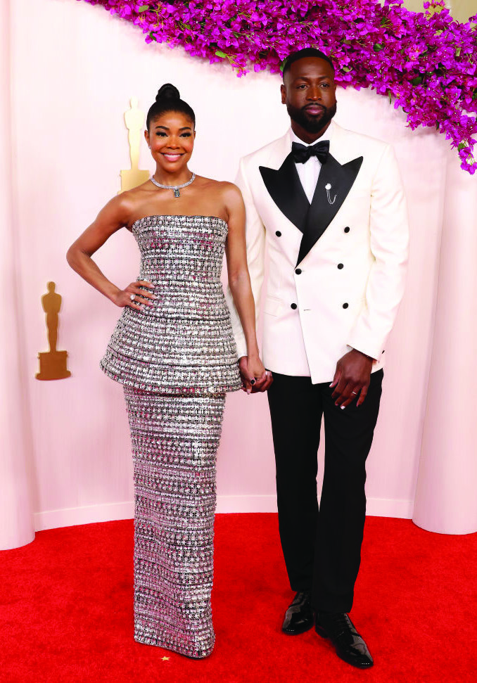 Gabrielle Union and Dwyane Wade’s Oscar 2024 look. Gabrielle Union and Dwyane Wade’s in the Oscar 2024 event using nail polish. manicure.
