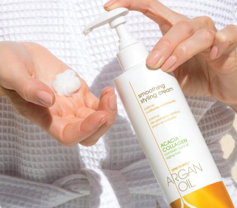 a faceless woman holding a Smoothing Styling Cream product from One ‘n Only