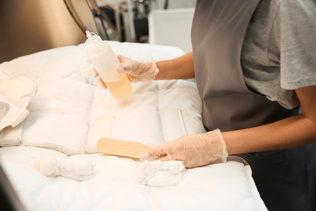 Close-up cleaning surface. Cleaning wax bed at a spa center.