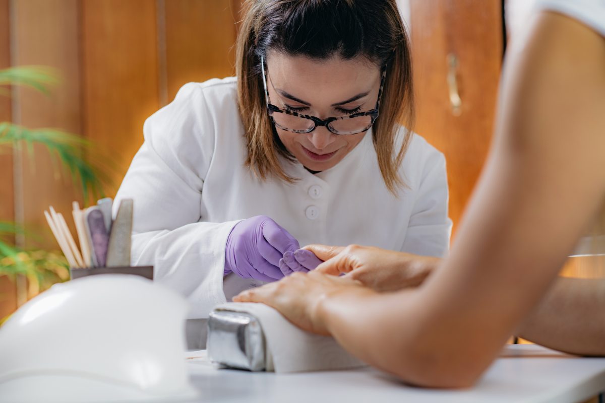 Removing Fingernail Cuticles in Beauty Salon. Freelance or salon work.