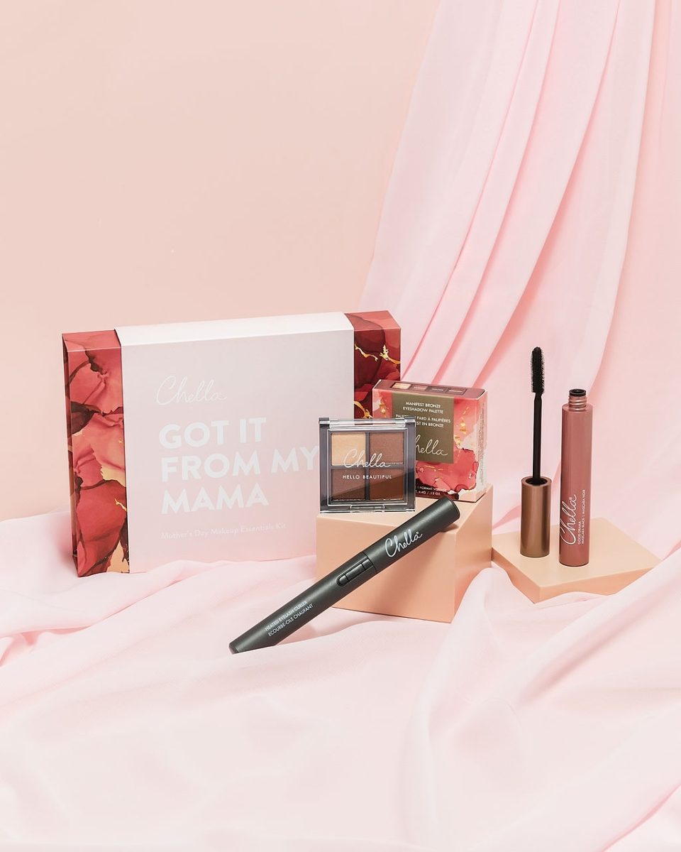Limited edition 'Got it from my Mama' beauty kit, perfect for gifting. The set includes the Manifest Bronze Mini Palette, Good Drama Mascara, and Deluxe Heated Lash Curler, arranged elegantly in a stylish package. Designed to pamper moms with essential beauty items, this kit makes for a thoughtful and radiant gift. The sleek design and rose-gold accents add a touch of luxury to the presentation.