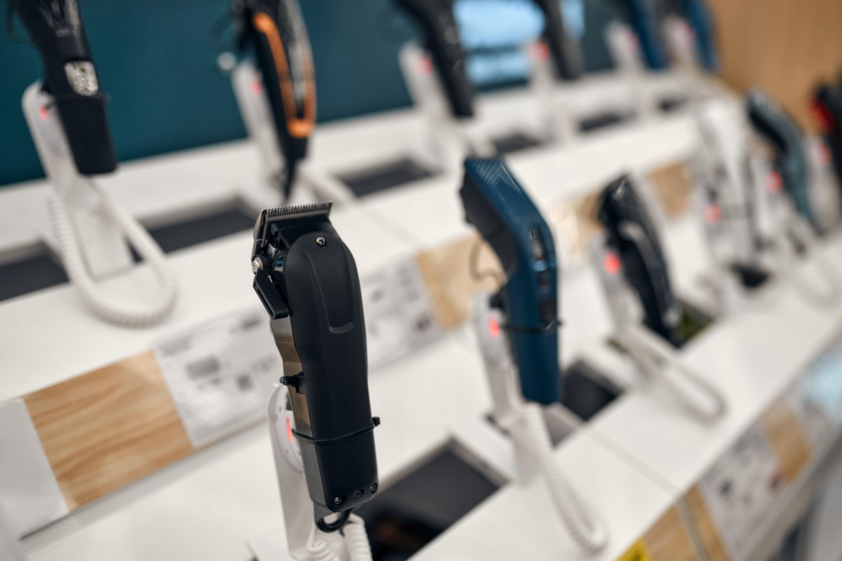 Showcase with electronic machines, trimmers and razors. Buying a new trimmer in the store. new clippers. hair clippers. professional clippers.