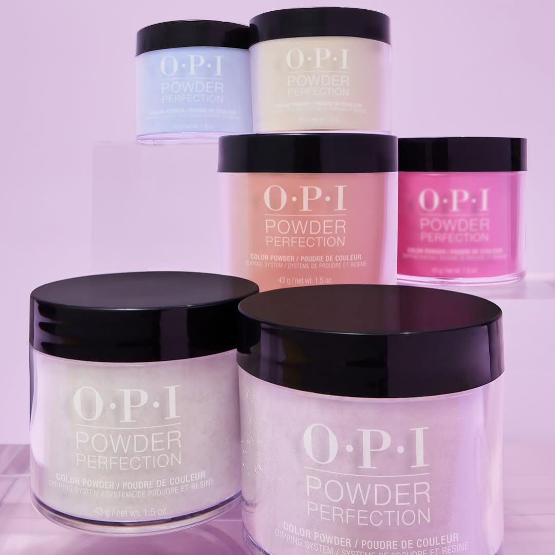 OPI Your Way Powder Perfection hues. Shades displayed on a light purple background:
Verified - bright blue crème
Buttafly - soft yellow shimmer
Apricot AF - bright, creamy orange
Without a Pout - hot pink crème
Suga Cookie - sheer purple glitter
Glitterally Shimmer - sparkly sheer yellow