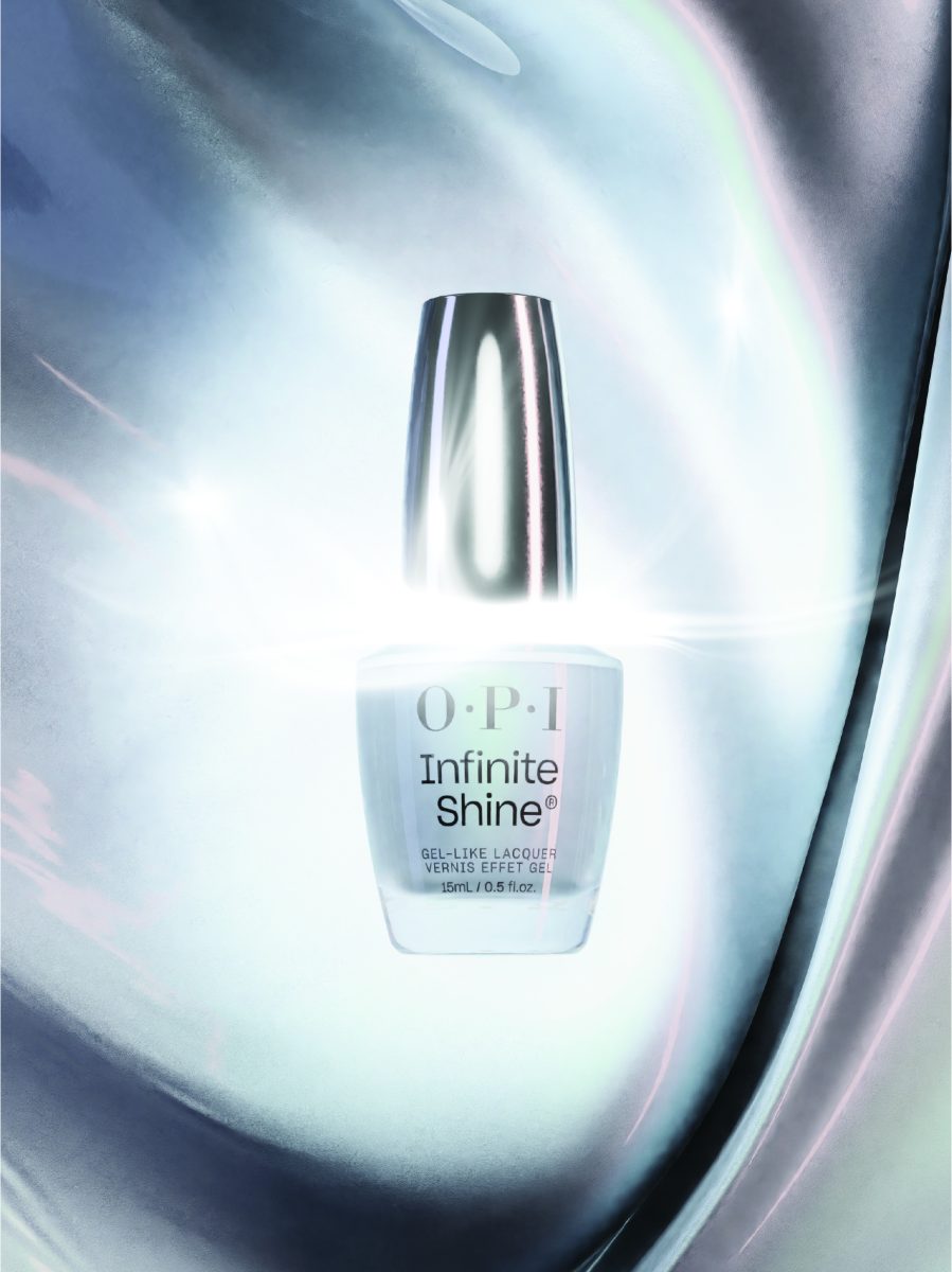 A bottle of OPI Infinite Shine nail polish with a metallic silver cap and a clear body labeled "O·P·I Infinite Shine® GEL-LIKE LACQUER VERNIS EFFET GEL 15mL / 0.5 fl. oz." The background is brightly illuminated, creating a glowing effect around the product, highlighting its radiant appearance. Showcases the sleek packaging and premium quality of the OPI Infinite Shine New Formula.