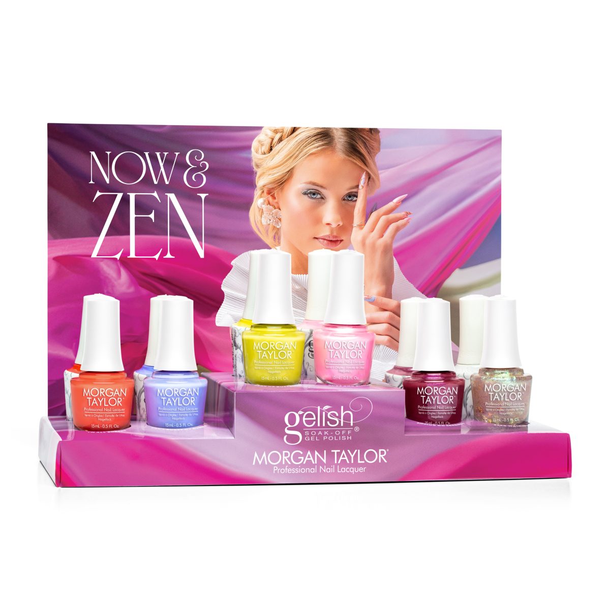 A display of Morgan Taylor professional nail lacquer from the Gelish Spring 2025 collection, featuring six different nail polish bottles in vibrant colors: orange, light blue, yellow, pink, dark red, and a glittery shade. The background includes a blurred image of a model holding her hand near her face, with a flowing fabric in shades of pink and purple.
