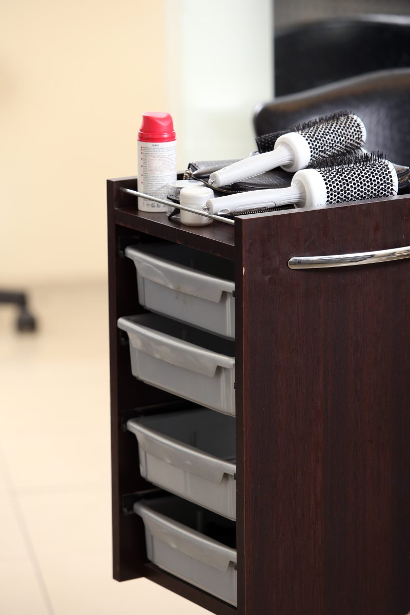 Hairdresser salon. Nightstand with shelves