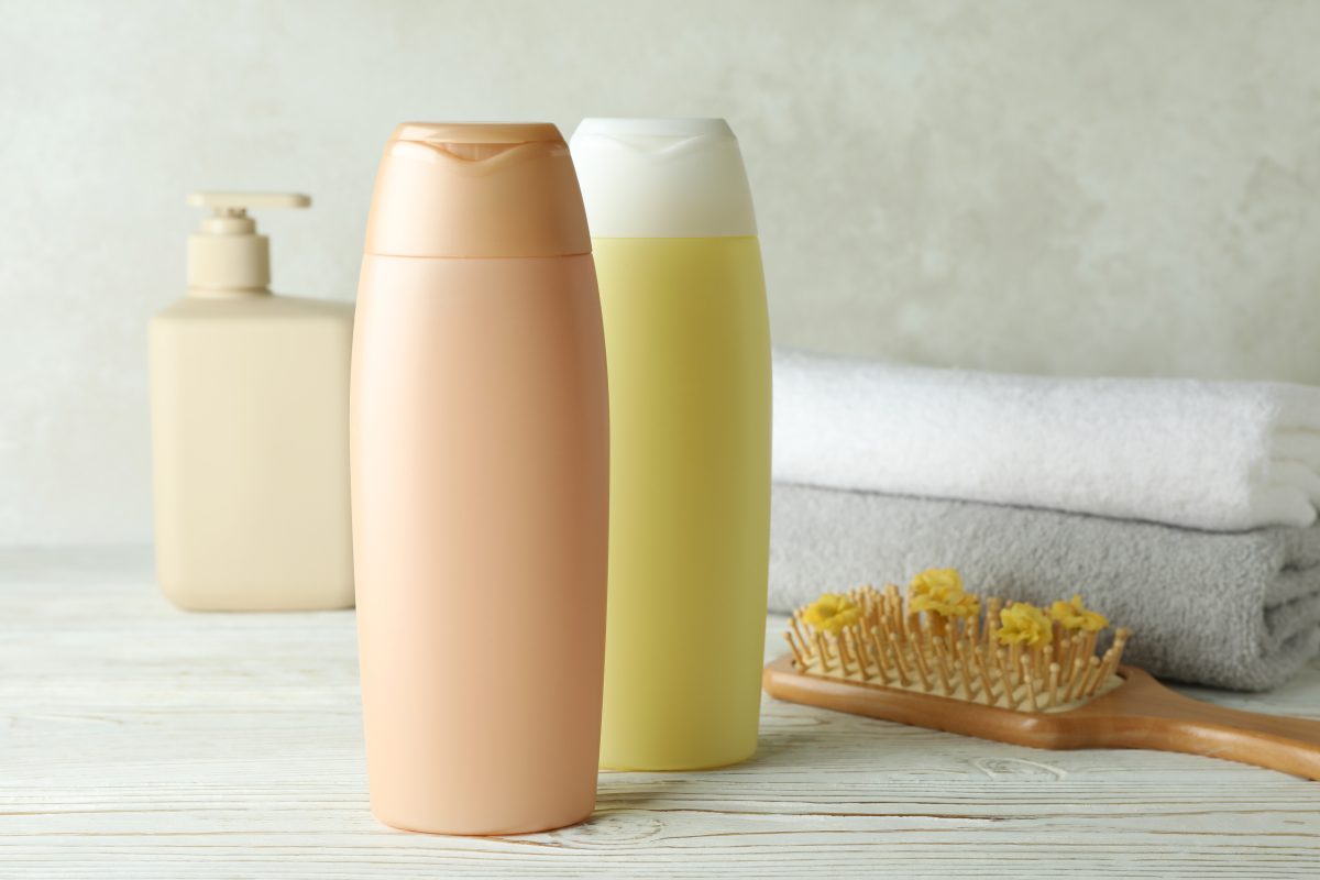 Recommended Sulfate-Free Shampoos. Hair care accessories on white wooden table. Hair care. hair treatment. 