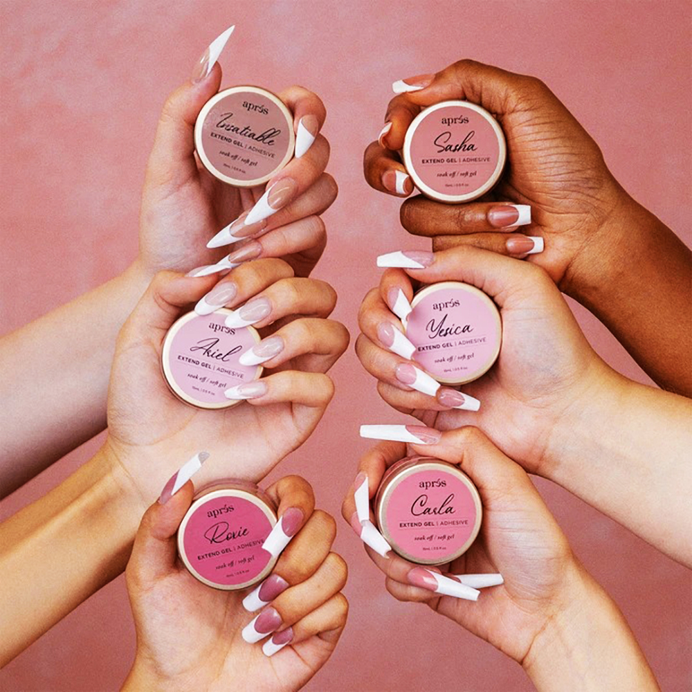 Diverse hands holding Apres Color Extend Gel jars alongside matching long Gel-X manicures with white French tip designs.